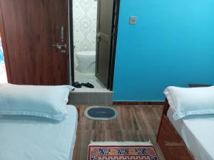 Postel nebo postele na pokoji v ubytování Sunshine homestay