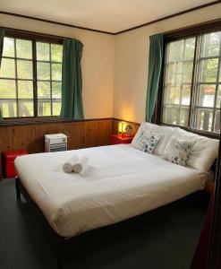 Ένα ή περισσότερα κρεβάτια σε δωμάτιο στο Hakuba Sea2Summit Hostel