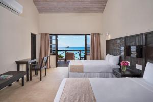 Letto o letti in una camera di Hawksbill Resort Antigua - All Inclusive