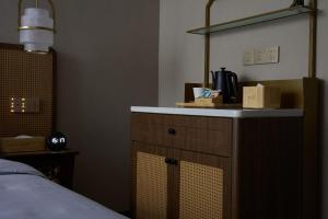 Ένα ή περισσότερα κρεβάτια σε δωμάτιο στο Renjoy Hotel -Xiamen Zhongshan Road Pedestrian Street