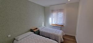 Postel nebo postele na pokoji v ubytování El Parque 5 Izda - Céntrico, Wifi, 3 Hab - VUT-6398-AS