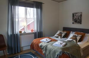 Postel nebo postele na pokoji v ubytování Snöå Bruk Hotell och konferens