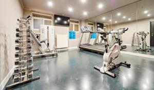a gym with a treadmill and a tread machine at Hotel The Augustin in Brussels +59 photos