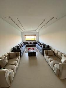 a large living room with couches in a room at Mansoria in Mohammedia