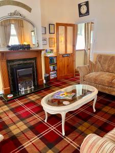 Posezení v ubytování Station Cottage