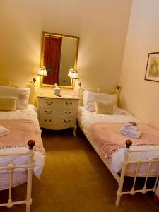 Postel nebo postele na pokoji v ubytování Station Cottage + 10 fotografií