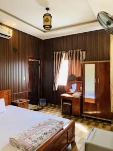 Postel nebo postele na pokoji v ubytování Khách Sạn Bảo Nam
