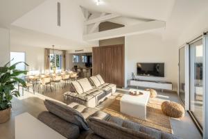 TV a/nebo společenská místnost v ubytování L'écho des Vagues