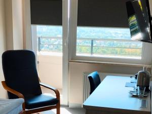Televízia a/alebo spoločenská miestnosť v ubytovaní Sanatorium Równica