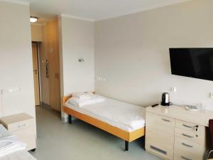 Posteľ alebo postele v izbe v ubytovaní Sanatorium Równica