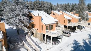 an aerial view of a house in the snow at Wabasso 8 Cozy Snowshoe Retreat Covered EZ Parking WiFi Deck in Snowshoe