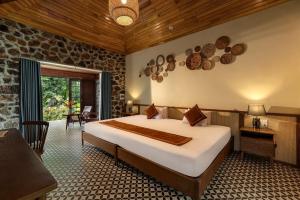 Postel nebo postele na pokoji v ubytování Nature Garden Ecolodge Ninh Bình