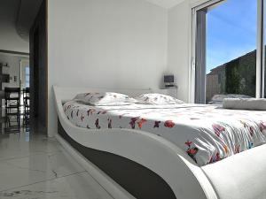 Posteľ alebo postele v izbe v ubytovaní Maison Sapiac - 4pers - 2 chambres - 3 lits - Clim réversible - Terrasse ombragée et grand jardin - Piscine saison estivale