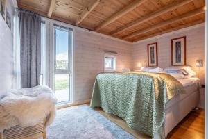 Postel nebo postele na pokoji v ubytování Lofoten Links Lodges