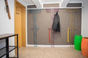 a room with four umbrellas hanging on a wall at Welcome in - Groepsaccommodatie met terras en berging in Winterberg +35 photos
