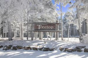 a sign that says tigersore in the snow at Treetop 15 Townhome Near Slopes Village Gated Parking Wi-Fi in Snowshoe