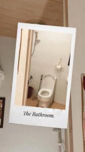 a picture of a bathroom with a toilet at TRP1 - Cozy 2BR Home near Aquaplanet & Clark Airport in Tacondo