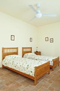 Ένα ή περισσότερα κρεβάτια σε δωμάτιο στο Agriturismo Vignarello