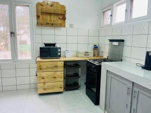 Kuchyň nebo kuchyňský kout v ubytování Casa Cinza