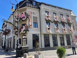 a building with a bunch of stuffed animals on it at Downtown Apartment in Craiova