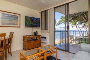 TV a/nebo společenská místnost v ubytování Kealia Resort 205