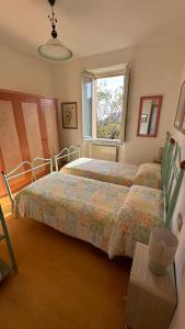 Postel nebo postele na pokoji v ubytování La casa di Perla