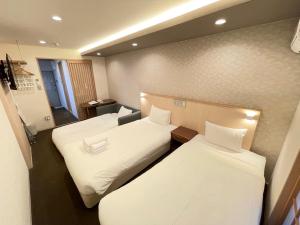 Rúm í herbergi á HIZ HOTEL Gion-Shirakawa