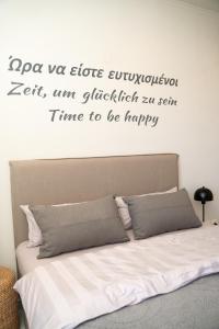 En eller flere senge i et værelse på FeWo Traum auf Rhodos