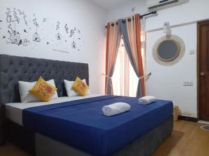 Ένα ή περισσότερα κρεβάτια σε δωμάτιο στο Andorra Tourist Resort Anuradhapura