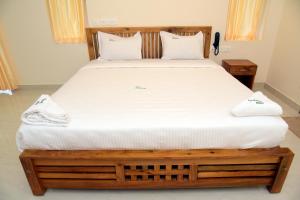 Postel nebo postele na pokoji v ubytování Villa Varkala