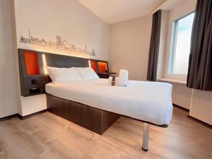 Postelja oz. postelje v sobi nastanitve easyHotel Zürich City Main Station
