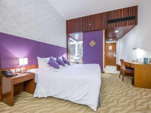 Postel nebo postele na pokoji v ubytování Novotel Nha Trang