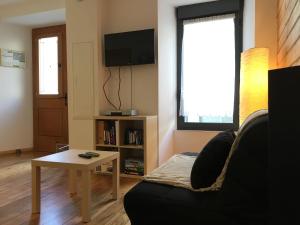 TV a/nebo společenská místnost v ubytování Appartement n° 32 + 4 fotografie