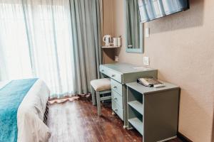 TV a/nebo společenská místnost v ubytování The Wilderness Hotel