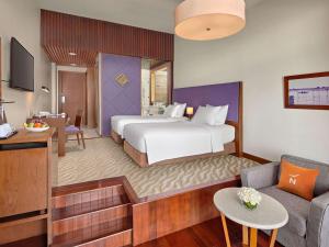 Postel nebo postele na pokoji v ubytování Novotel Nha Trang