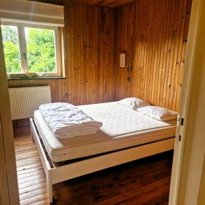 Postel nebo postele na pokoji v ubytování Woodstone