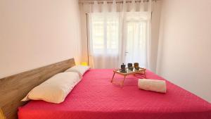 Postel nebo postele na pokoji v ubytování Appartamento Madagascar by Ca-Sa Check