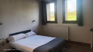 Łóżko lub łóżka w pokoju w obiekcie Casa rural Lastoetxe