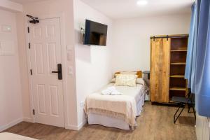 Hotel Rural La Bodega del Baldomero客房内的一张或多张床位