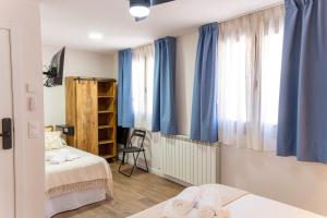 Hotel Rural La Bodega del Baldomero客房内的一张或多张床位