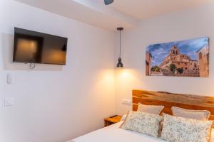 Hotel Rural La Bodega del Baldomero客房内的一张或多张床位