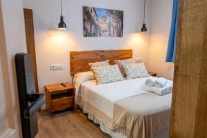 Hotel Rural La Bodega del Baldomero客房内的一张或多张床位