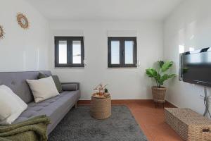 TV a/nebo společenská místnost v ubytování Duplex em Baía do Seixal
