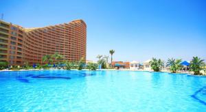 a large swimming pool in front of a hotel at Porto Sokhna Majestic in Ain Sokhna