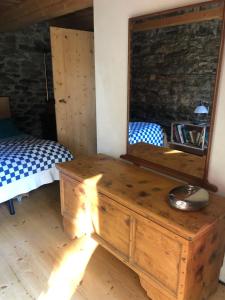 Postelja oz. postelje v sobi nastanitve Rustico Gin Avegno Torbecc, Vallemaggia, Tessin,
