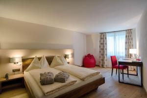 Una cama o camas en una habitación de Hotel Cervo