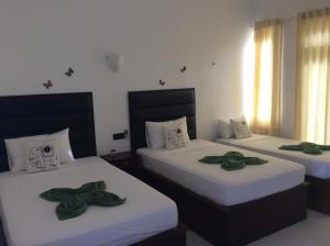 Postel nebo postele na pokoji v ubytování Lemazone Inn