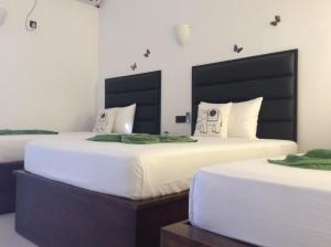 Postel nebo postele na pokoji v ubytování Lemazone Inn