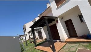 an open door of a building with a porch at Casa Rural Rincón del Lago in El Ronquillo