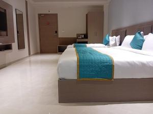 Hotel shree ji inn客房内的一张或多张床位